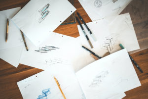 5-ways-to-use-concepting-ideation-effectively-with-your-designer-peterman-firm-blog-concept-sketches-pens-and-penciles-on-a-desk